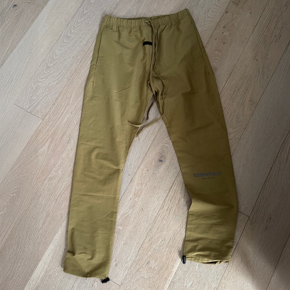 Fear of God Essentials Track Pants in Amber - Picture 1 of 4